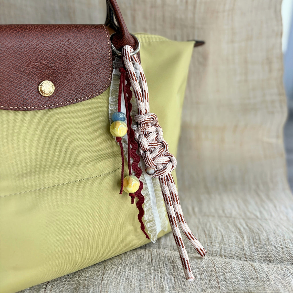 Hand-knotted Paracord Bag Charm With Ribbons - Maroon + Cream