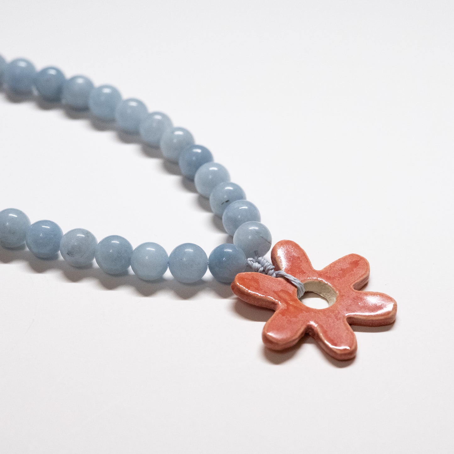 Chunky Blue Beaded Necklace with Pink Ceramic Flower